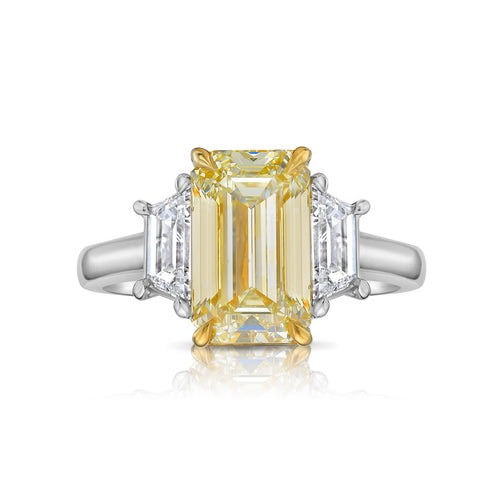 Light yellow emerald-cut diamond ring with excellent cut, VS2 clarity, and GIA certification.