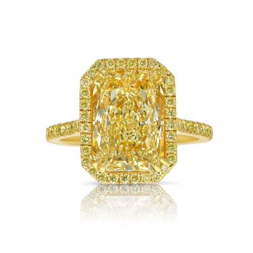 Old money yellow halo diamond engagement ring featuring a GIA certified light yellow elongated radiant diamond.