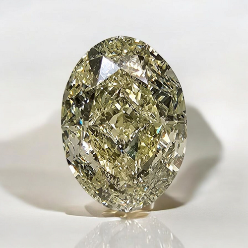 Light yellow oval cut diamond with VS1 clarity, excellent cut, GIA certified.