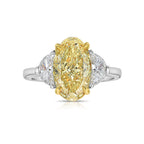 Stunning yellow oval cut diamond engagement ring featuring SI1 clarity.