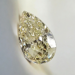 Light yellow pear-shaped diamond with VS1 clarity, excellent cut, and GIA certifi