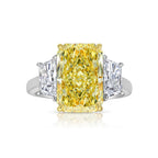 GIA certified fancy yellow elongated radiant diamond engagement ring with a striking center.