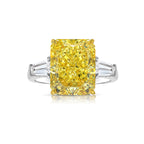 Luxurious yellow elongated radiant diamond engagement ring with a stunning hue.