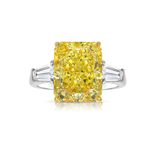 Luxurious yellow elongated radiant diamond engagement ring with a stunning hue with a VVS2 clarity.