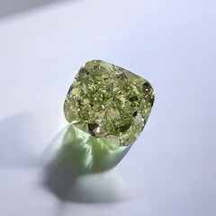 Yellowish green cushion cut diamond, GIA certified.