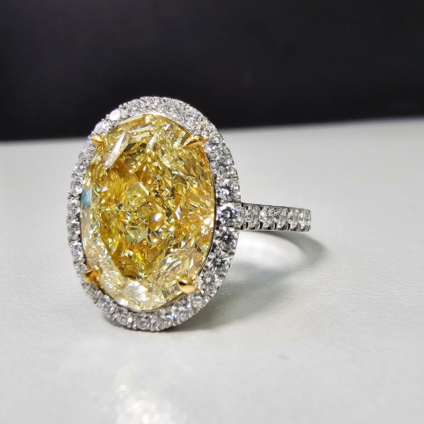 6 carat fancy light yellow diamond oval halo ring