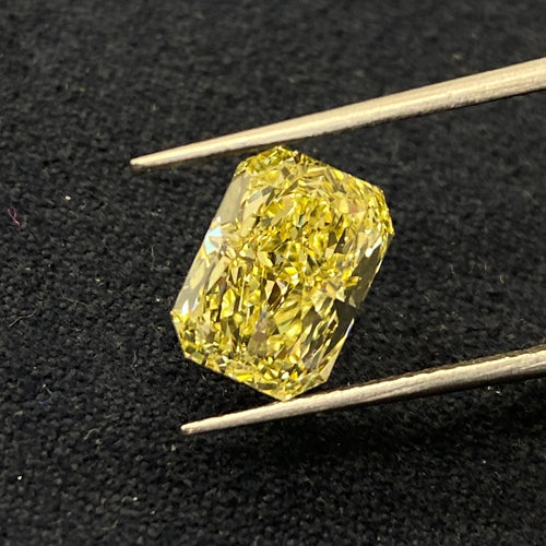 Elongated radiant cut fancy yellow diamond. Long fancy yellow radiant cut.