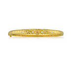 Yellow pear shaped diamond and white round diamonds set in 18k yellow gold domed bangle bracelet.