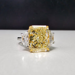 5.34 Carat Fancy Light Yellow Radiant Three Stone Diamond Ring