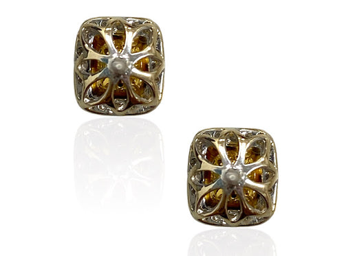 Fancy intense yellow cushion diamond studs with a F/VS2 clarity.