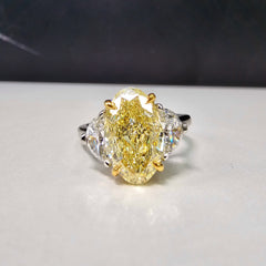 3ct Fancy Light Yellow Oval Three Stone Diamond Ring, a canary oval diamond!