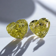 Unique matched pair yellow heart shaped diamonds, GIA certified.