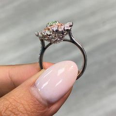 green diamond ring surrounded by pink and white natural diamonds in a reversible ring and pendant 