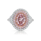 Ethereal natural pink oval diamond ring with a stunning halo design with SI1 clarity.