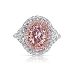 Ethereal natural pink oval diamond ring with a stunning halo design.