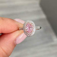 Pink diamond ring. pink diamond engagement ring. light pink diamonds. light pink oval diamond. Unique engagement ring.