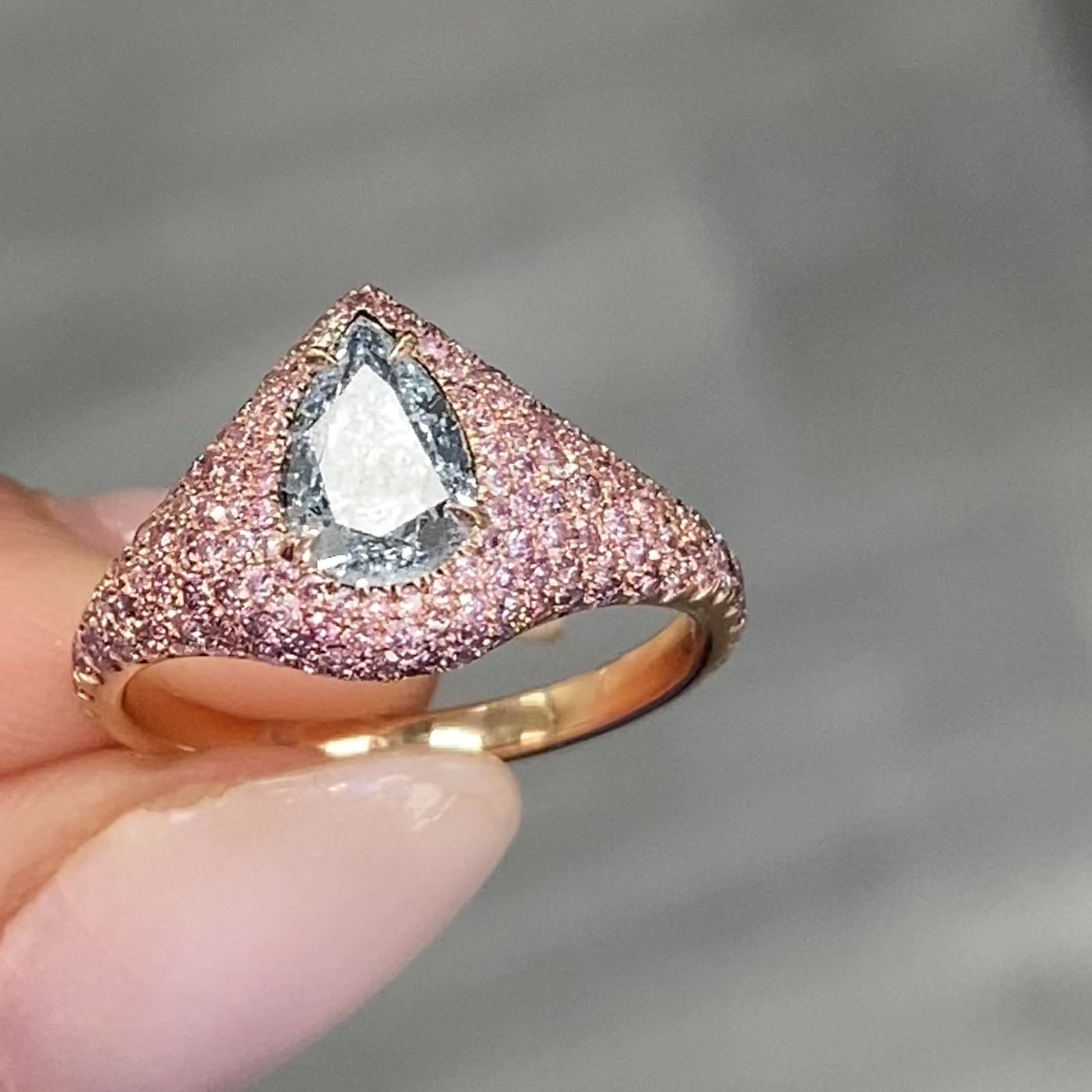 GIA light blue pear shape diamond ring set with natural pink diamonds