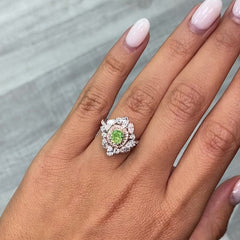 green diamond ring surrounded by pink and white natural diamonds in a reversible ring and pendant 