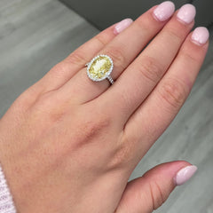 6 carat fancy light yellow diamond oval halo ring, unique yellow diamond engagement ring