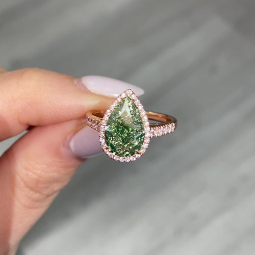 GIA Certified green diamond pear shape ring. Green diamond jewelry. JLO green diamond