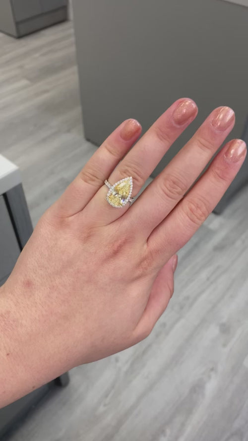 yellow pear shape diamond ring. yellow diamond pear shape. yellow pear shape halo ring. yellow diamond pear. yellow diamond ring.