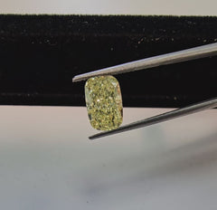 3 Carat Fancy yellow elongated cushion cut diamond.