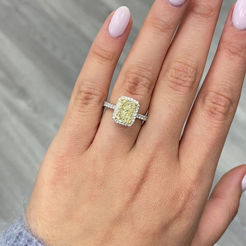 Yellow diamond engagement ring, radiant cut canary diamond with white diamond halo engagement ring