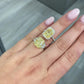 5.34 Carat Fancy Light Yellow Radiant Three Stone Diamond Ring next to a halo ring of the same size