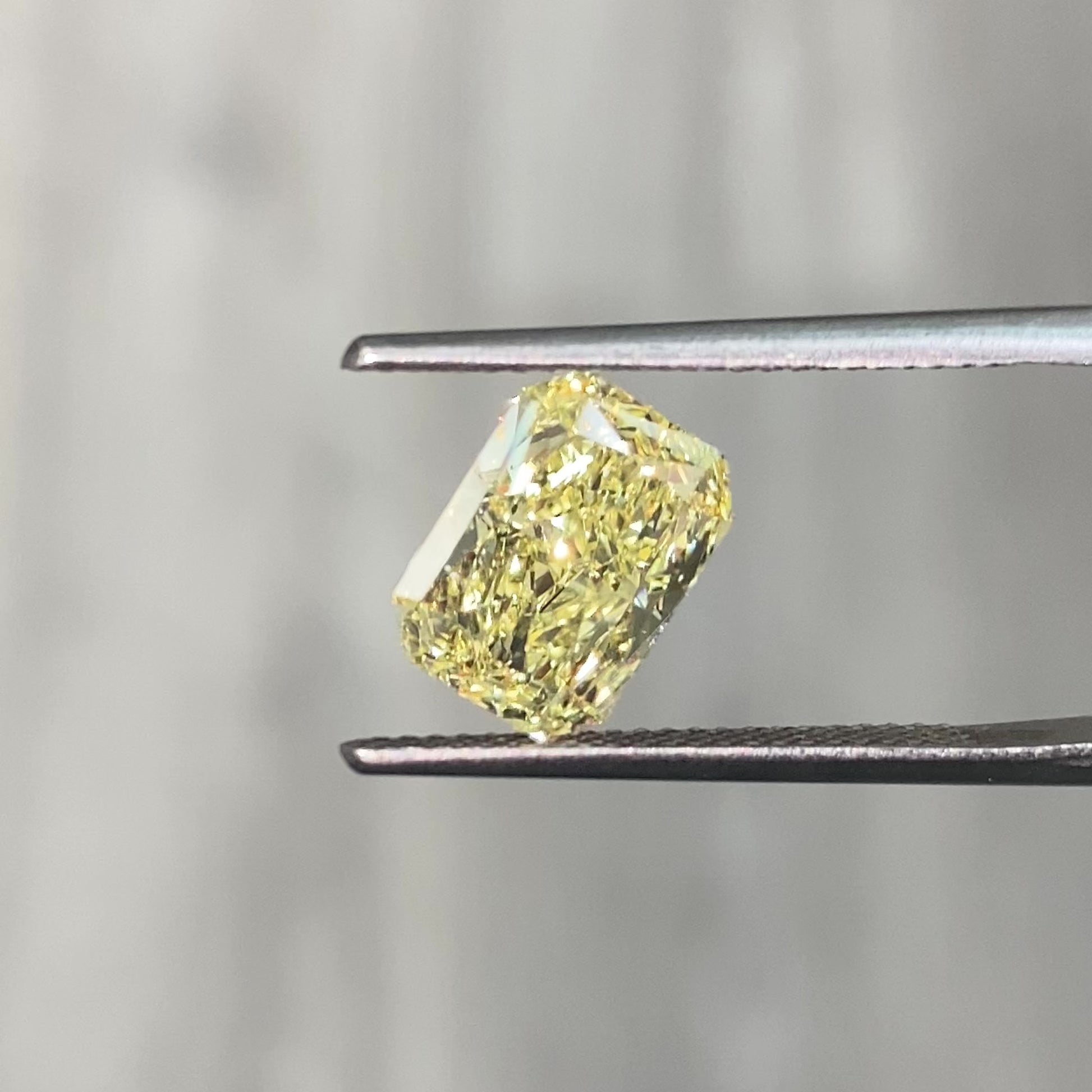 Elongated fancy yellow radiant diamond. Long yellow radiant diamond.
