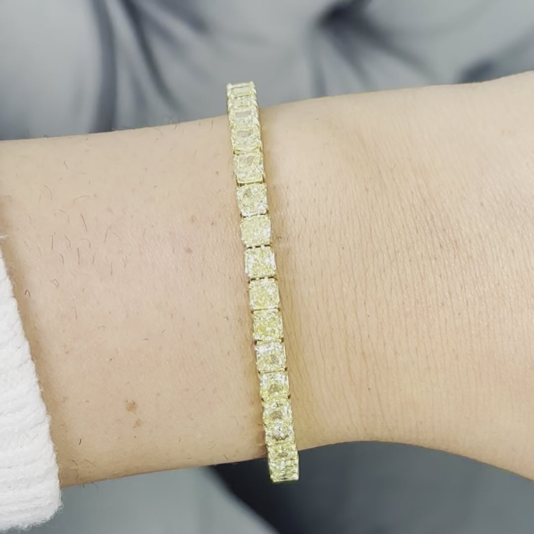Fancy yellow diamond bracelet. Cushion diamond bracelet. Cushion tennis bracelet. Yellow diamond jewelry. Yellow tennis bracelet. Natural yellow diamonds;