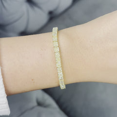 Fancy yellow diamond bracelet. Cushion diamond bracelet. Cushion tennis bracelet. Yellow diamond jewelry. Yellow tennis bracelet. Natural yellow diamonds;