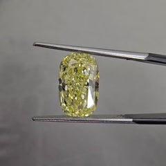 Elongated fancy yellow diamond cushion cut. Long fancy yellow diamond cushion cut. yellow diamond cushion. 5 carat fancy yellow.