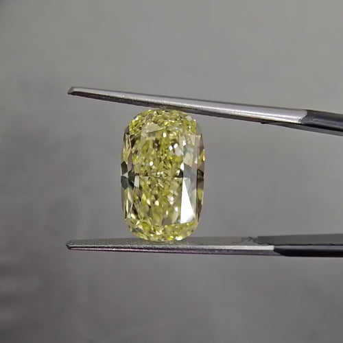 Elongated fancy yellow diamond cushion cut. Long fancy yellow diamond cushion cut. yellow diamond cushion. 5 carat fancy yellow.