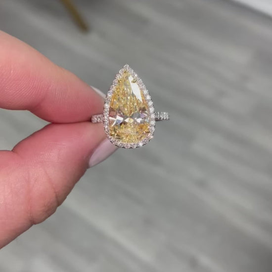 yellow pear shape diamond ring. yellow diamond pear shape. yellow pear shape halo ring. yellow diamond pear. yellow diamond ring.