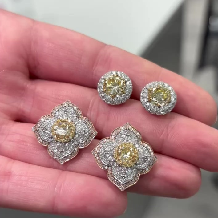 Light yellow and fancy light yellow diamond studs, in a flower theme with 1.5 carats of surrounding white and yellow diamonds