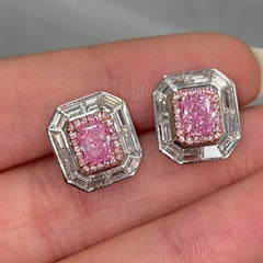 Natural pink elongated radiant diamond studs with GIA certified pink center and white diamond accents.