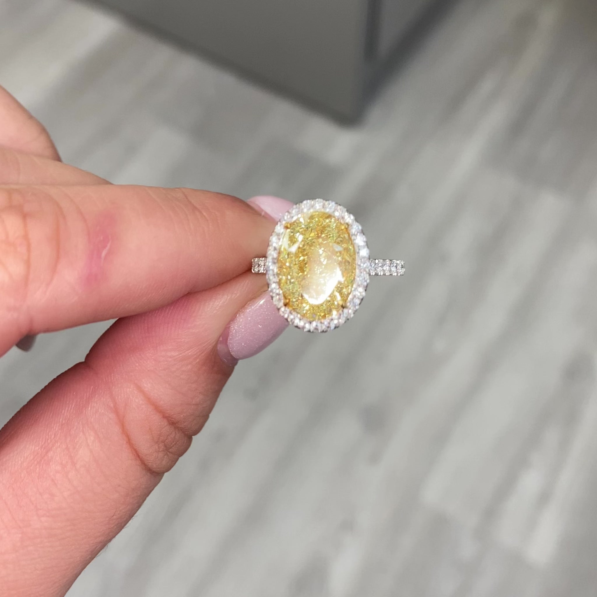 6 carat fancy light yellow diamond oval halo ring, unique yellow diamond engagement ring