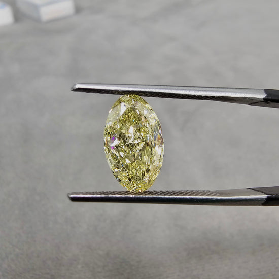 3 carat fancy light yellow elongated oval diamond. 3 carat long oval yellow diamond.