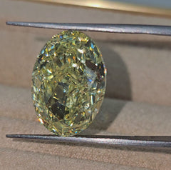 Fancy radiant yellow VS2 oval cut diamond, GIA certified.