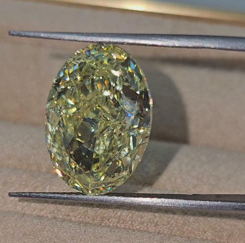 Fancy radiant yellow VS2 oval cut diamond, GIA certified.