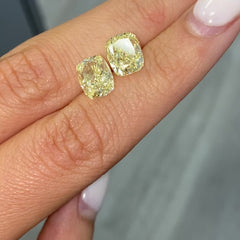 matched pair of natural fancy light yellow cushion cut diamonds 