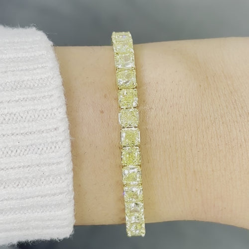 Fancy yellow diamond bracelet. Cushion diamond bracelet. Cushion tennis bracelet. Yellow diamond jewelry. Yellow tennis bracelet. Natural yellow diamonds