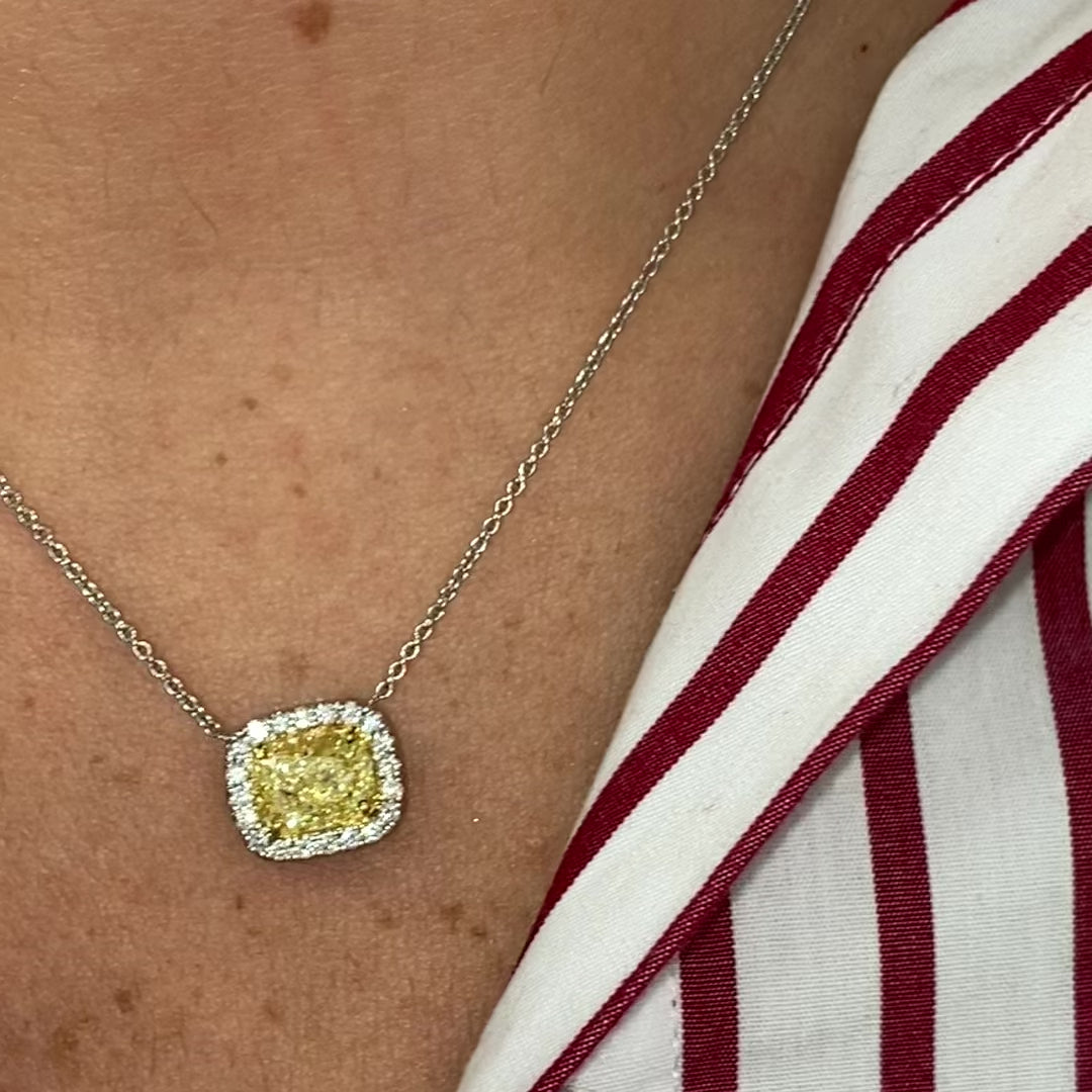 Stunning natural yellow diamond Necklace with White Halo diamonds and a VVS1 clarity.