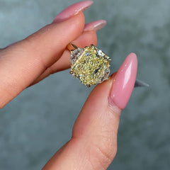 5 carat fancy light yellow elongated radiant cut diamond ring in yellow gold on female hand video