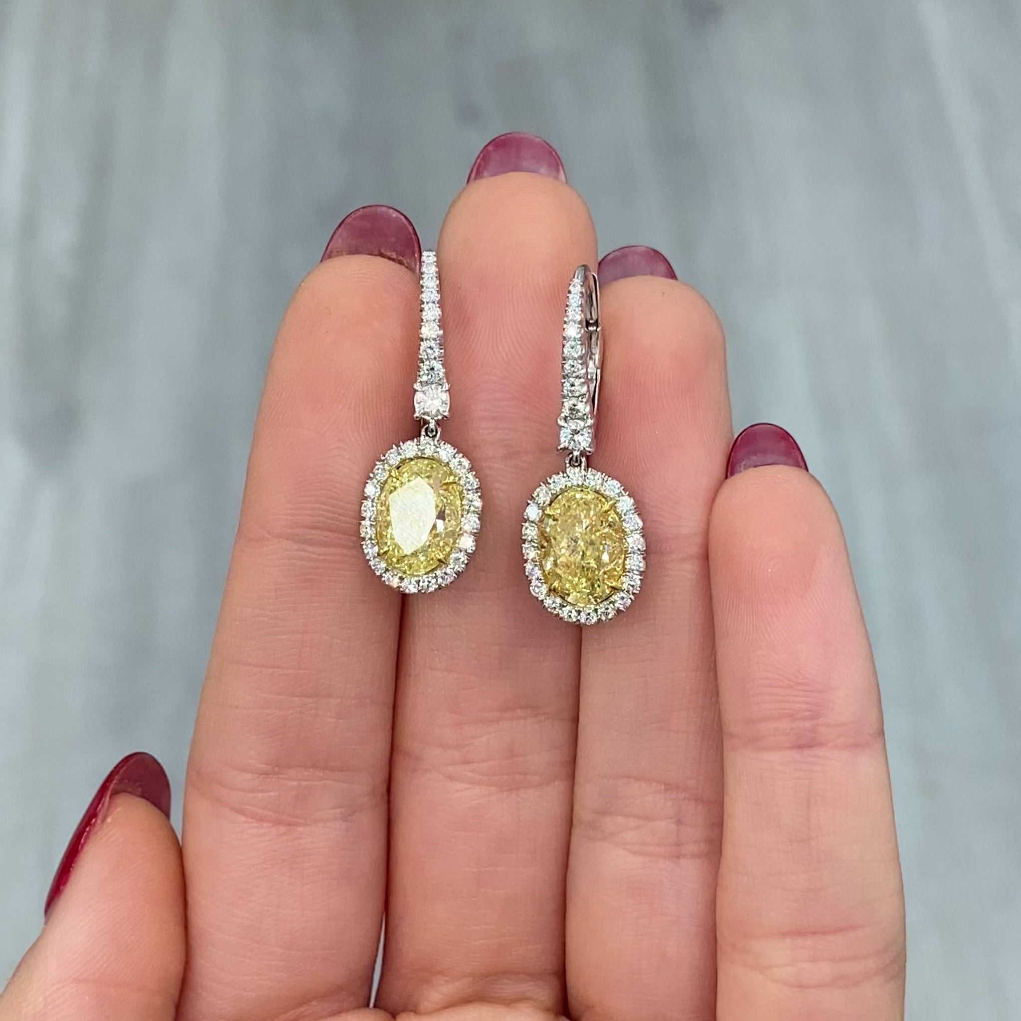 oval diamond earrings. yellow diamond oval earrings. yellow diamond ovals. yellow diamond earrings.