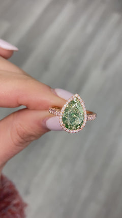 GIA Certified green diamond pear shape ring. Green diamond jewelry. JLO green diamond.