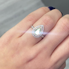 1.01 Carat Fancy Light Brownish Greenish Yellow Pear 0.50 Carats of surrounding diamonds VS1 Clarity Very Good, Excellent, None Fluorescence Handset in 18k Gold GIA Certified Diamond