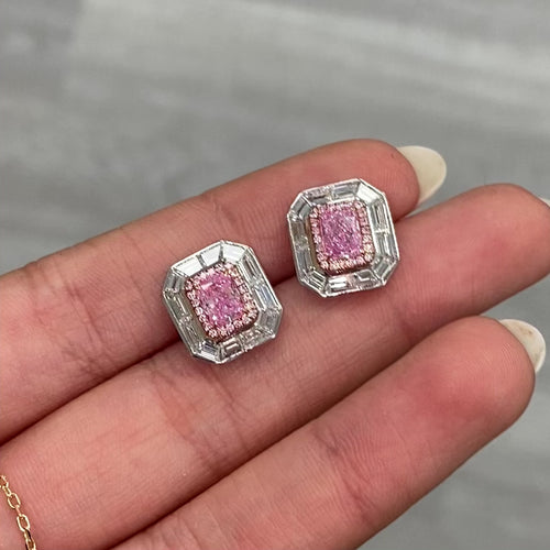 Natural pink elongated radiant diamond studs with GIA certified pink center and white diamond accents.