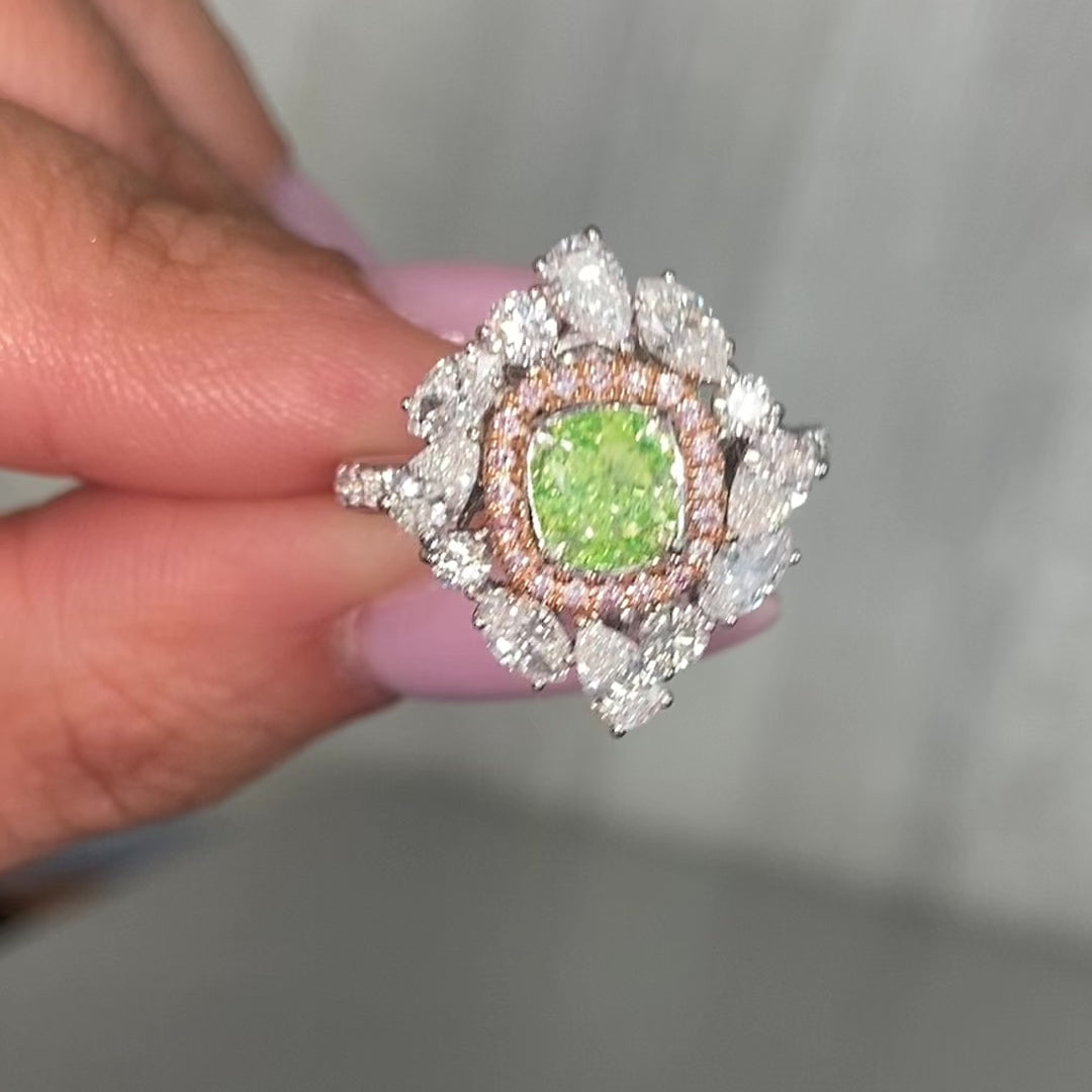 green diamond ring surrounded by pink and white natural diamonds in a reversible ring and pendant 