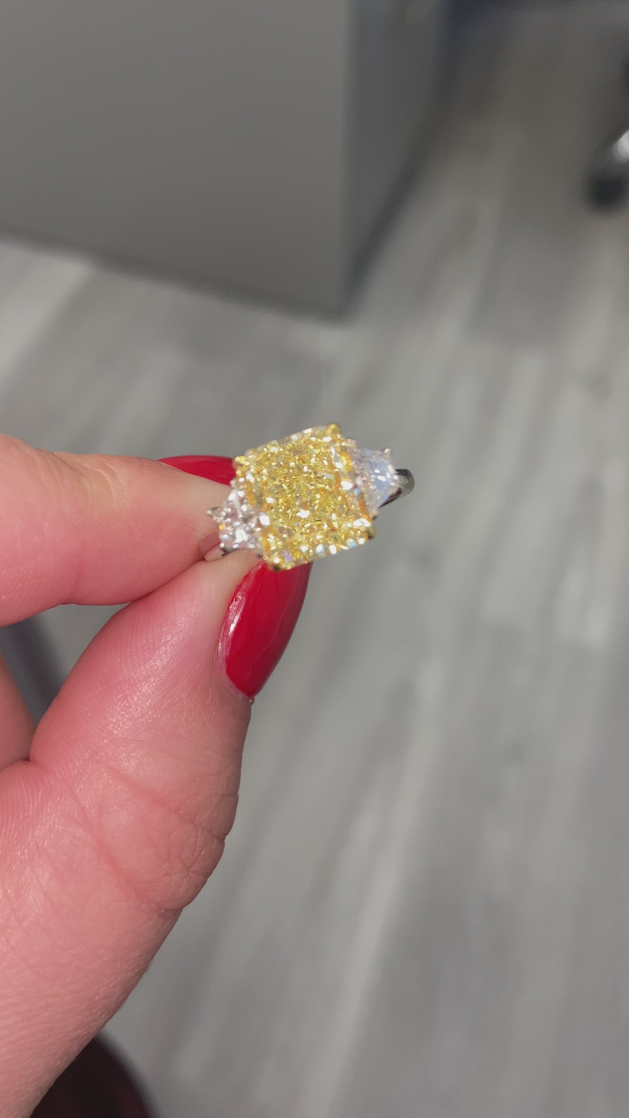 4 carat fancy yellow radiant set in 3 stone platinum ring